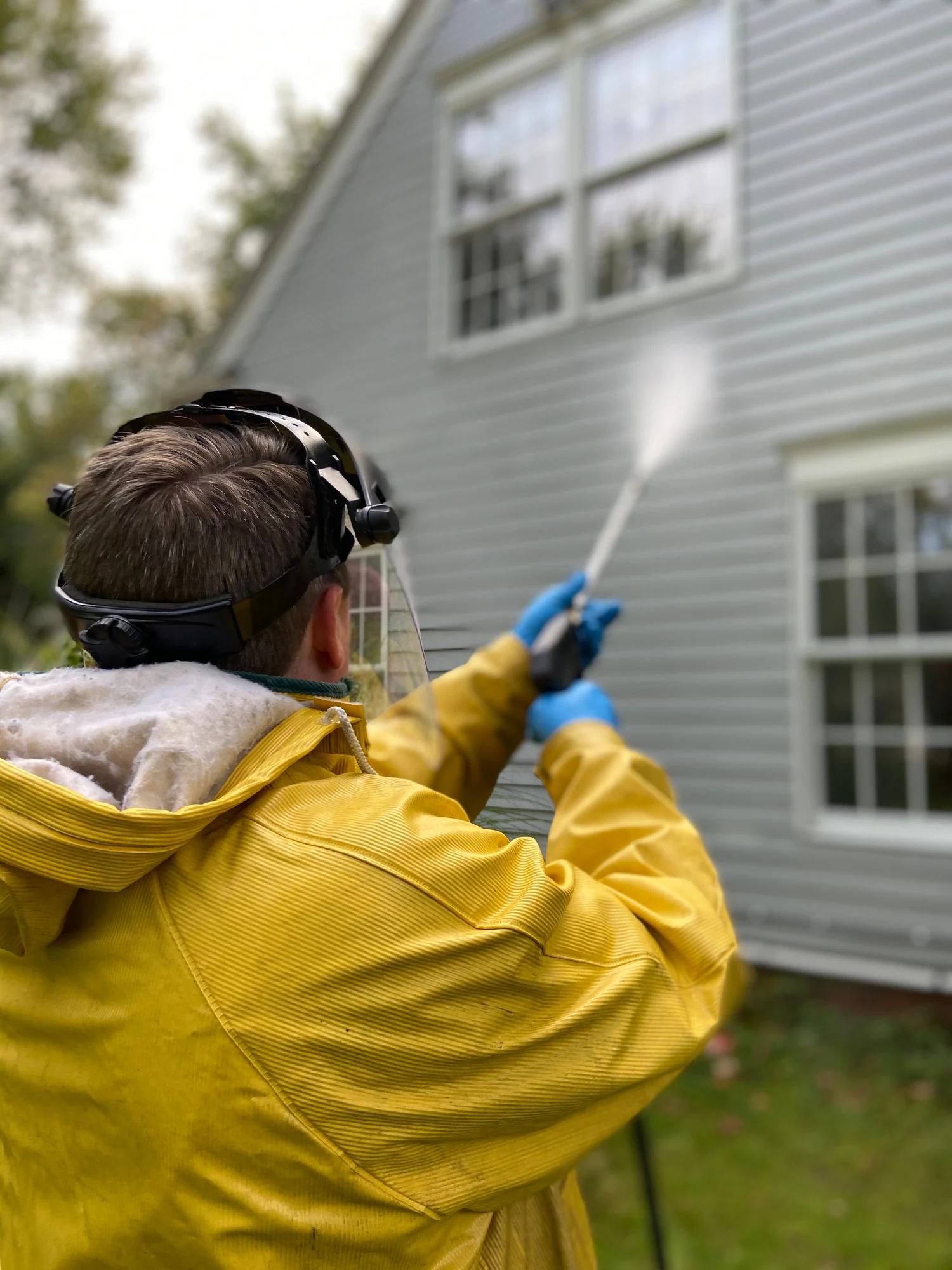 Illustrative photo of pressure washing exterior house siding